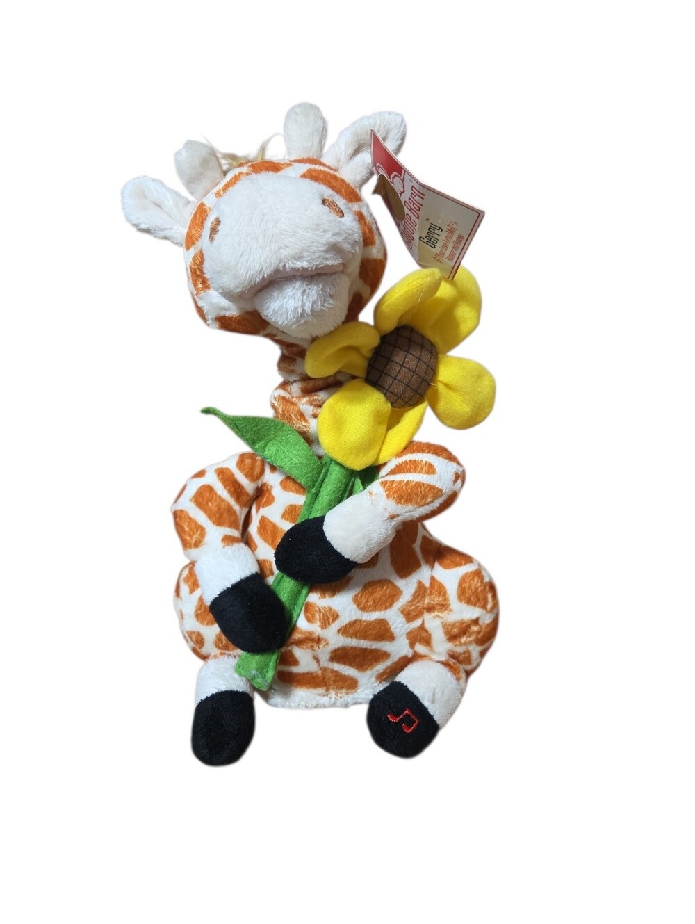 Cuddle Barn Gerry the Giraffe animated plush toy holding a yellow sunflower New